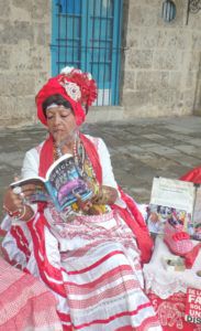 Adelaida_with_book_Cubicle_to_Cuba_by_Heidi_Siefkas_in_Old_Havana_Cuba
