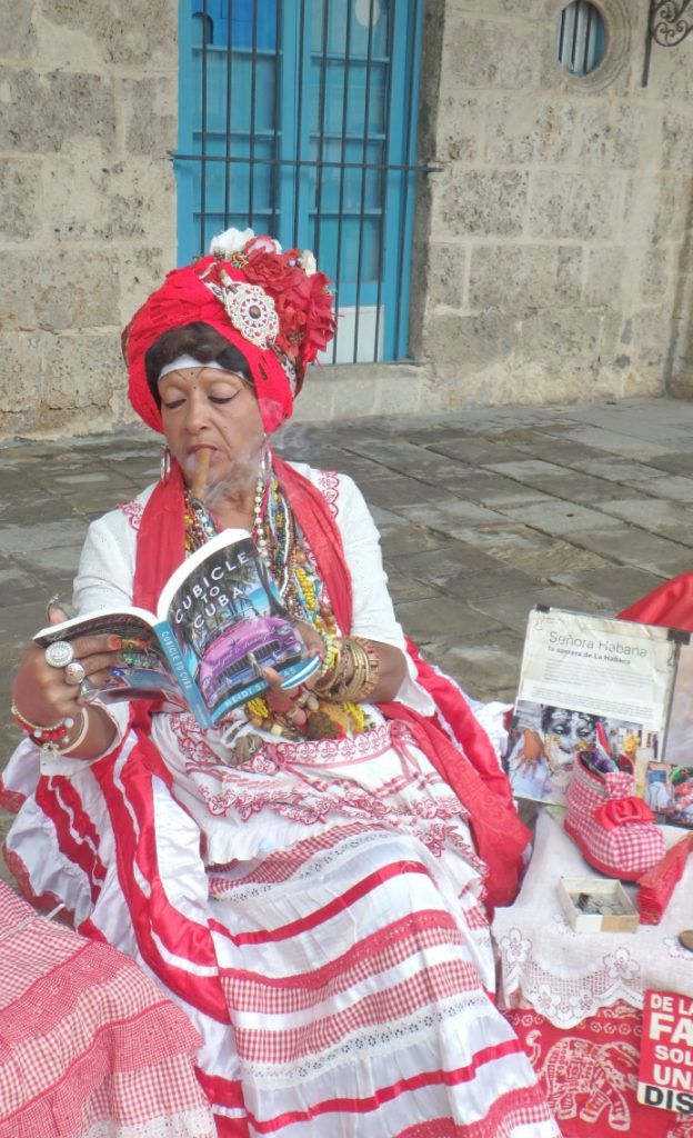Adelaida_with_book_Cubicle_to_Cuba_by_Heidi_Siefkas_in_Old_Havana_Cuba