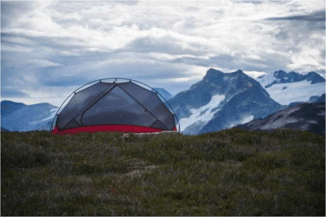 Tent_atop_mountain_landscape