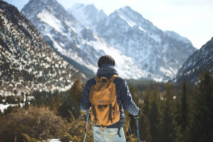 man-with-backpack-hiking-in-the-mountains